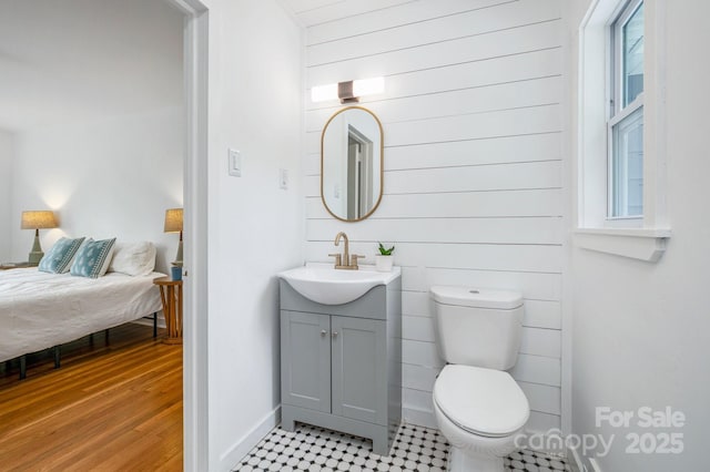 12 Canterbury Rd, Asheville, NC 28805 - bathroom with vanity, toilet, baseboards, and wood finished floors