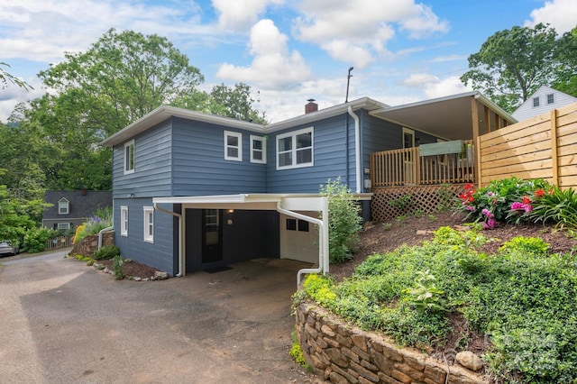12 Canterbury Rd, Asheville, NC 28805 - view of front of house featuring a chimney, driveway, and an attached garage