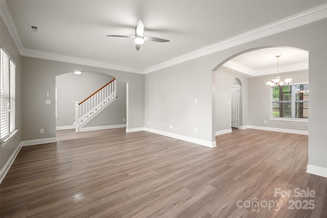 14034 Cedar Pond Cir, Huntersville, NC 28078 - unfurnished living room with ceiling fan, arched walkways, wood finished floors, baseboards, and stairs