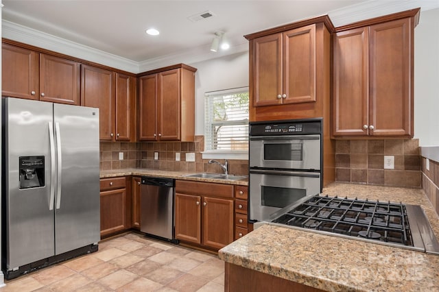 14034 Cedar Pond Cir, Huntersville, NC 28078 - kitchen with appliances with stainless steel finishes, brown cabinetry, a sink, backsplash, and crown molding