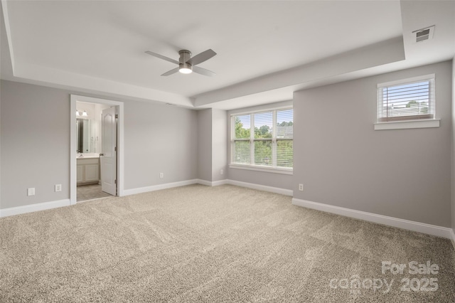 14034 Cedar Pond Cir, Huntersville, NC 28078 - unfurnished bedroom with a raised ceiling, carpet flooring, baseboards, ensuite bath, and ceiling fan