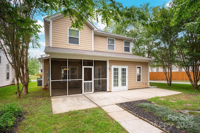 14034 Cedar Pond Cir, Huntersville, NC 28078 - rear view of property featuring a sunroom, a patio, central AC unit, and a shingled roof