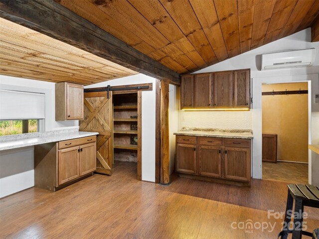 161 Moody Mountain Rd, Burnsville, NC 28714 - kitchen featuring vaulted ceiling, a wall mounted air conditioner, a barn door, light countertops, and wood ceiling