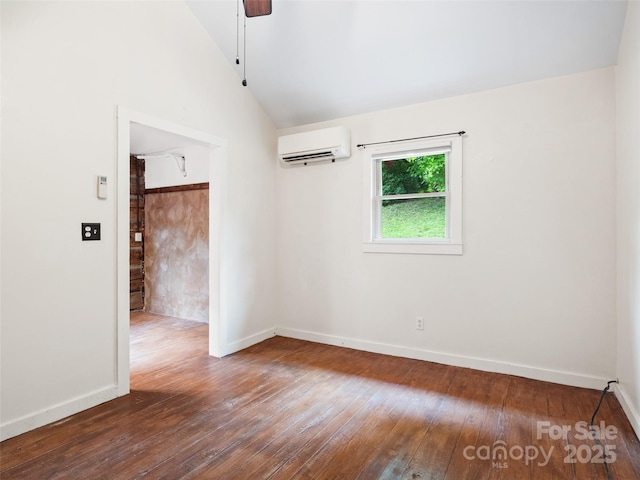 161 Moody Mountain Rd, Burnsville, NC 28714 - spare room featuring a wall mounted air conditioner, hardwood / wood-style floors, vaulted ceiling, and baseboards