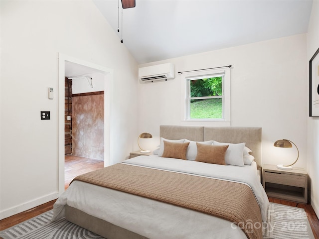 161 Moody Mountain Rd, Burnsville, NC 28714 - bedroom with an AC wall unit, wood finished floors, vaulted ceiling, baseboards, and a ceiling fan
