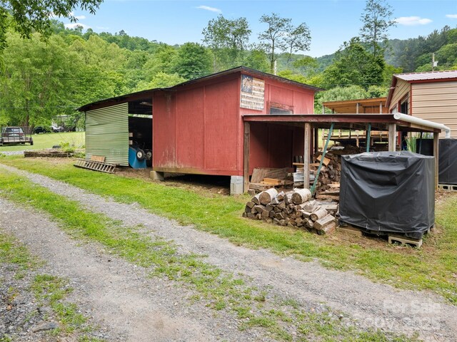 161 Moody Mountain Rd, Burnsville, NC 28714 - view of outbuilding featuring an outdoor structure and a view of trees