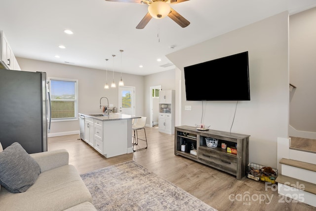2242 Bear Creek Rd, Leicester, NC 28748 - living room with a ceiling fan, light wood-type flooring, recessed lighting, stairs, and baseboards