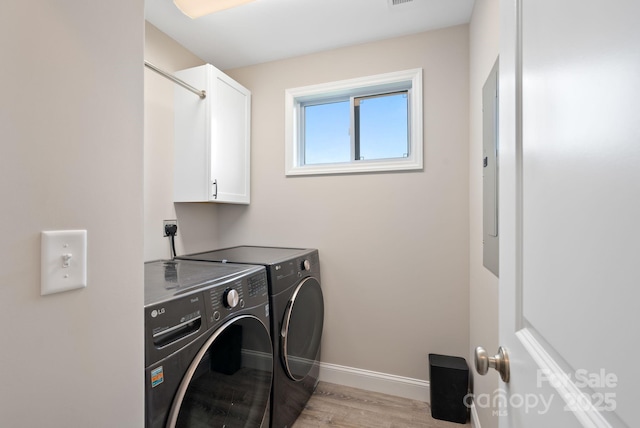 2242 Bear Creek Rd, Leicester, NC 28748 - washroom with cabinet space, washing machine and dryer, baseboards, and light wood-style flooring