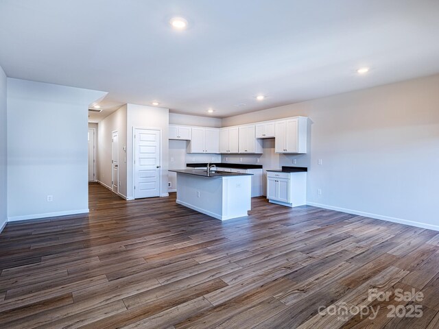 2541 Ruby Dixon Crossing Dr Unit 18, Gastonia, NC 28056 - kitchen featuring dark countertops, a sink, open floor plan, dark wood-style floors, and recessed lighting