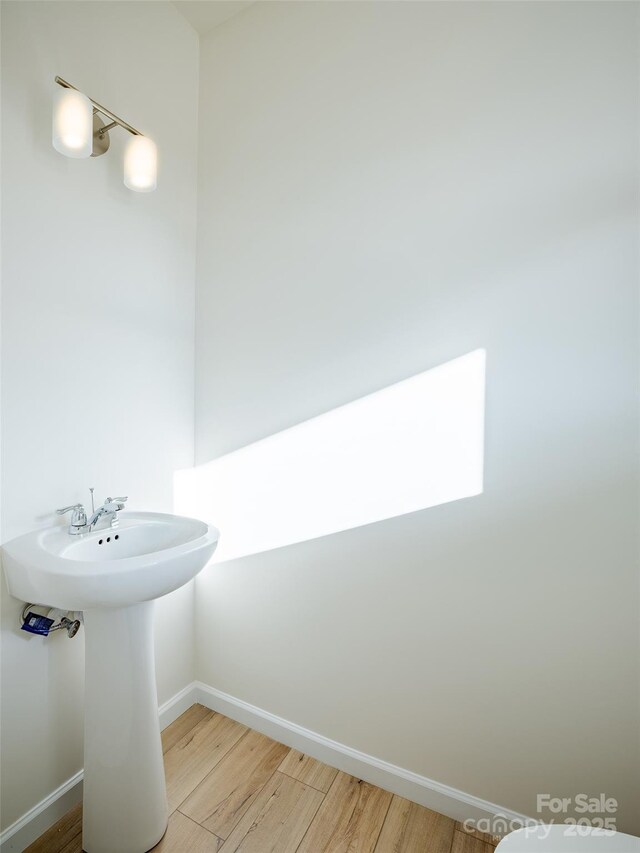 2541 Ruby Dixon Crossing Dr Unit 18, Gastonia, NC 28056 - bathroom with wood finished floors, baseboards, and a sink