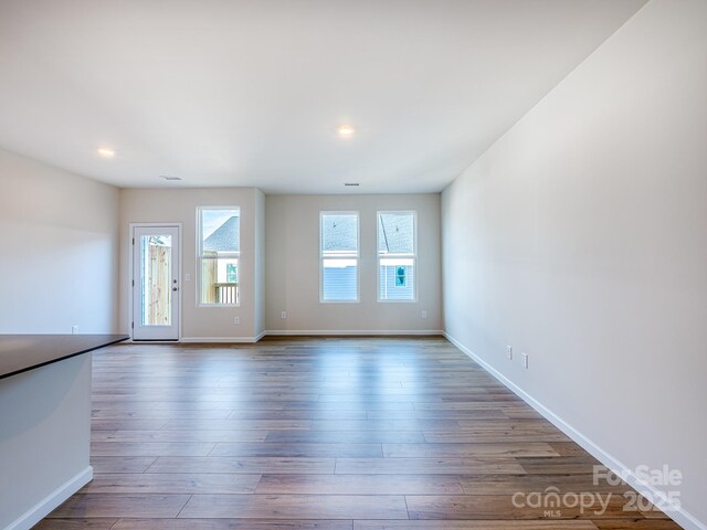2541 Ruby Dixon Crossing Dr Unit 18, Gastonia, NC 28056 - unfurnished room with baseboards, wood finished floors, and recessed lighting