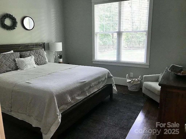 bedroom featuring wood finished floors