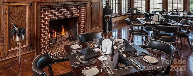 detailed view of a fireplace and wood finished floors