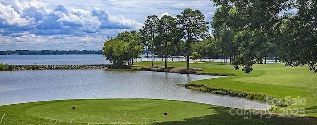 view of property's community featuring a water view, golf course view, and a yard