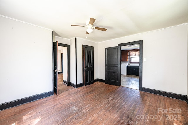 3042 N Oxford St, Claremont, NC 28610 - unfurnished bedroom featuring washer / dryer, hardwood / wood-style flooring, baseboards, crown molding, and ceiling fan