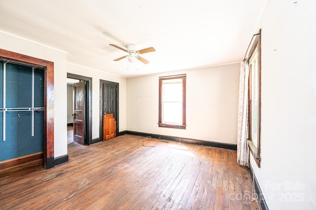 3042 N Oxford St, Claremont, NC 28610 - unfurnished bedroom with hardwood / wood-style floors, baseboards, ceiling fan, and ornamental molding