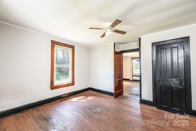 3042 N Oxford St, Claremont, NC 28610 - unfurnished room with wood-type flooring, crown molding, a ceiling fan, and baseboards