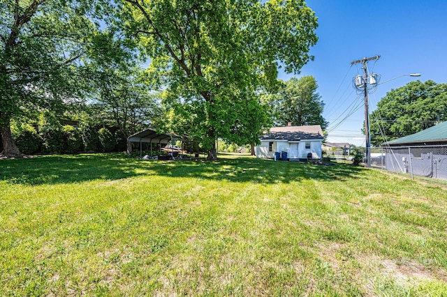 3042 N Oxford St, Claremont, NC 28610 - view of yard featuring a carport