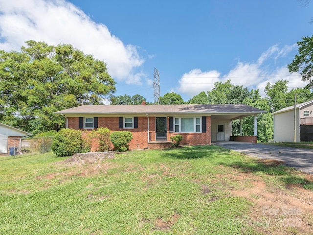 876 Stowe Ln, Gastonia, NC 28056 - single story home featuring brick siding, driveway, and an attached carport