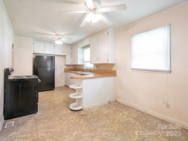 876 Stowe Ln, Gastonia, NC 28056 - kitchen featuring black appliances, light floors, a ceiling fan, white cabinetry, and open shelves