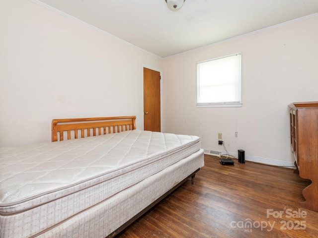 876 Stowe Ln, Gastonia, NC 28056 - bedroom featuring crown molding, wood finished floors, and baseboards