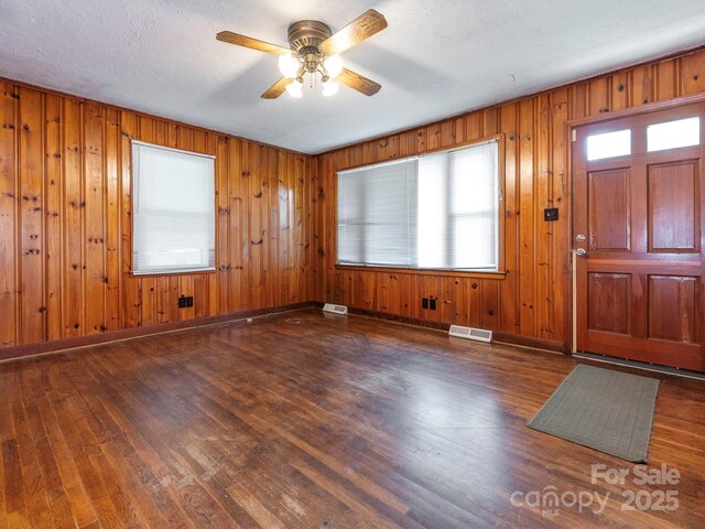 876 Stowe Ln, Gastonia, NC 28056 - entryway with wood finished floors, ceiling fan, wood walls, and baseboards