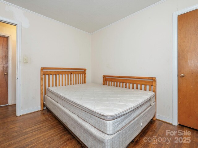 876 Stowe Ln, Gastonia, NC 28056 - bedroom with wood finished floors, ornamental molding, and baseboards