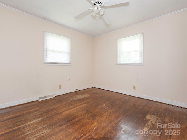 876 Stowe Ln, Gastonia, NC 28056 - spare room with ornamental molding, wood-type flooring, a ceiling fan, and baseboards