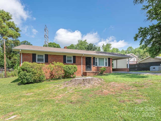 876 Stowe Ln, Gastonia, NC 28056 - single story home with brick siding, a front yard, a carport, and a chimney