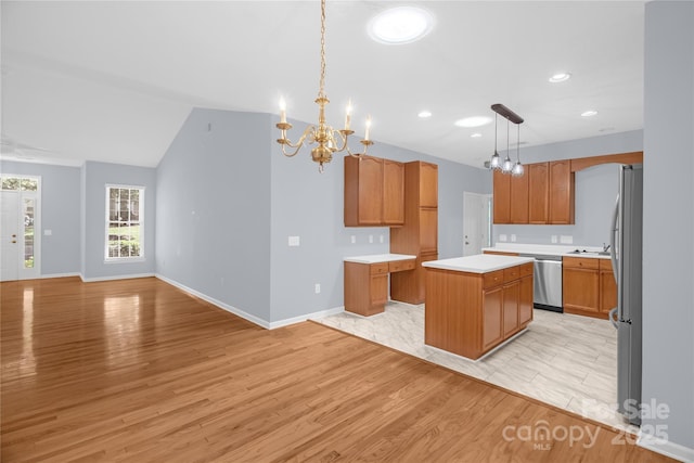 4467 Antelope Ln, Charlotte, NC 28269 - kitchen featuring a chandelier, a kitchen island, light countertops, recessed lighting, and stainless steel appliances
