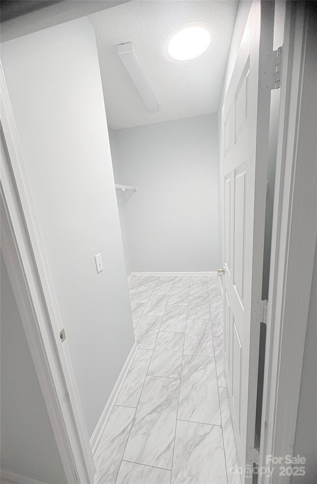 4467 Antelope Ln, Charlotte, NC 28269 - hallway featuring light marble finish flooring and baseboards