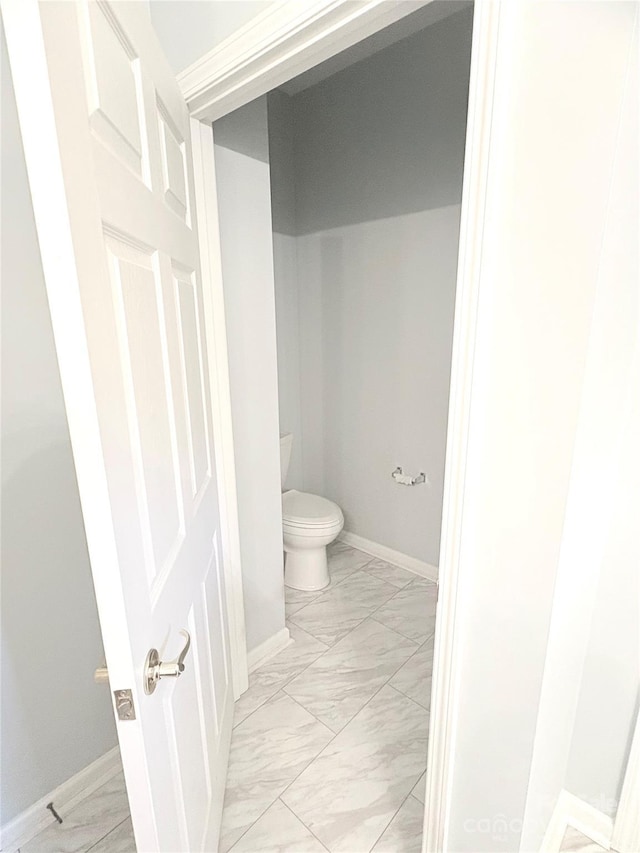 4467 Antelope Ln, Charlotte, NC 28269 - bathroom featuring marble finish floors and toilet