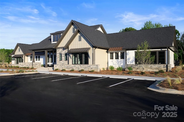 view of building exterior featuring uncovered parking