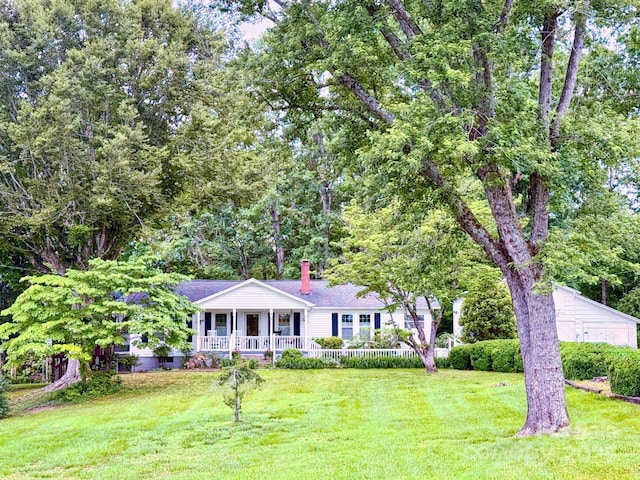 1441 Cove Rd, Rutherfordton, NC 28139 - view of front facade featuring a porch, a chimney, and a front lawn