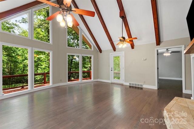 82 Sunburst Dr, Waynesville, NC 28786 - unfurnished living room featuring a ceiling fan, high vaulted ceiling, beam ceiling, wood finished floors, and baseboards