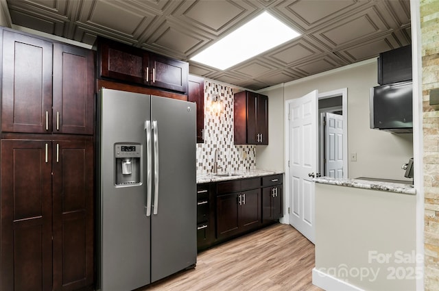 82 Sunburst Dr, Waynesville, NC 28786 - kitchen featuring stainless steel fridge, a sink, backsplash, an ornate ceiling, and light stone countertops
