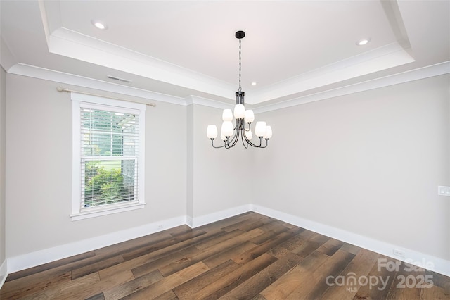 720 Cavesson Way, Monroe, NC 28110 - spare room featuring a raised ceiling, ornamental molding, dark wood-type flooring, a chandelier, and recessed lighting