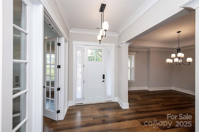 720 Cavesson Way, Monroe, NC 28110 - foyer featuring ornamental molding, dark wood-type flooring, and a chandelier