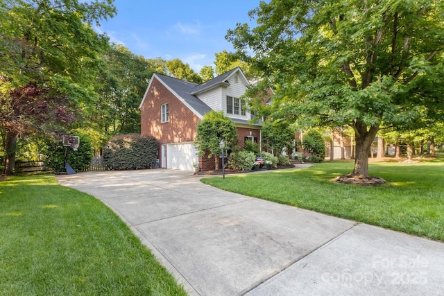 4389 Enchantment Cove Ln, Charlotte, NC 28216 - view of front of property with brick siding, an attached garage, driveway, and a front lawn