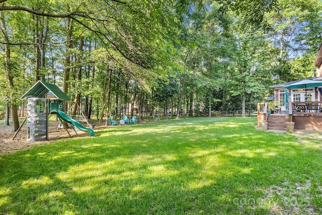 4389 Enchantment Cove Ln, Charlotte, NC 28216 - view of yard with a wooden deck and a playground