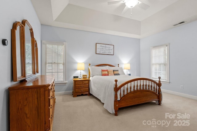 4389 Enchantment Cove Ln, Charlotte, NC 28216 - bedroom with a raised ceiling, light carpet, baseboards, and a ceiling fan