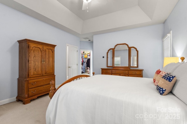 4389 Enchantment Cove Ln, Charlotte, NC 28216 - bedroom featuring light colored carpet, a walk in closet, a ceiling fan, a raised ceiling, and baseboards