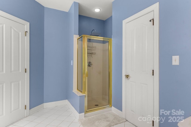 4389 Enchantment Cove Ln, Charlotte, NC 28216 - full bath featuring tile patterned flooring, a stall shower, and baseboards