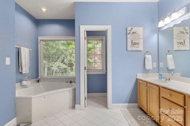 4389 Enchantment Cove Ln, Charlotte, NC 28216 - bathroom featuring a garden tub, vanity, and tile patterned flooring
