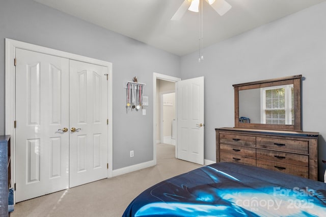 4389 Enchantment Cove Ln, Charlotte, NC 28216 - carpeted bedroom with a closet, a ceiling fan, and baseboards