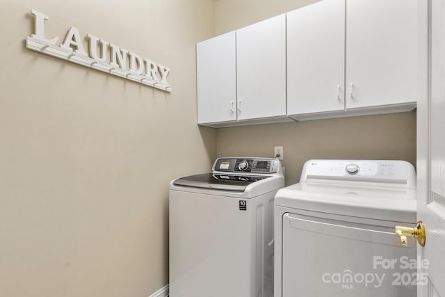 4389 Enchantment Cove Ln, Charlotte, NC 28216 - laundry area with cabinet space and washer and clothes dryer