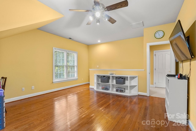 4389 Enchantment Cove Ln, Charlotte, NC 28216 - unfurnished living room featuring wood finished floors, a ceiling fan, and baseboards