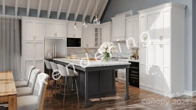 88 Lost Trl Unit 143, Highlands, NC 28741 - kitchen featuring black microwave, tasteful backsplash, a kitchen island, light countertops, and wood finished floors