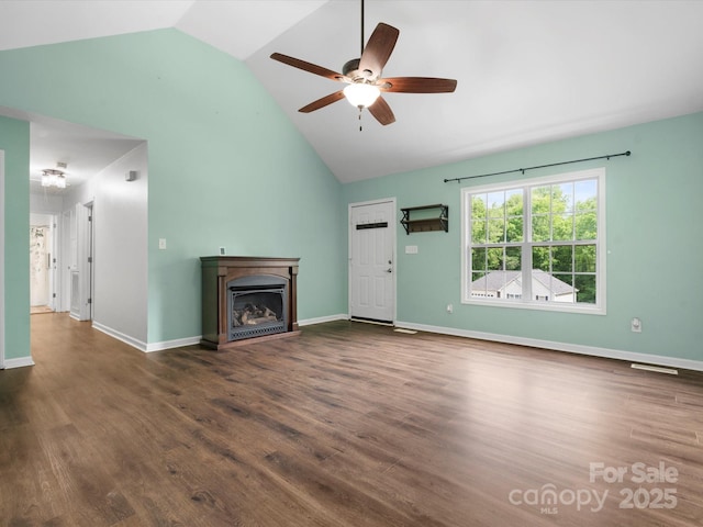 730 Cove Rd, Gastonia, NC 28052 - unfurnished living room with a ceiling fan, a fireplace, wood finished floors, high vaulted ceiling, and baseboards