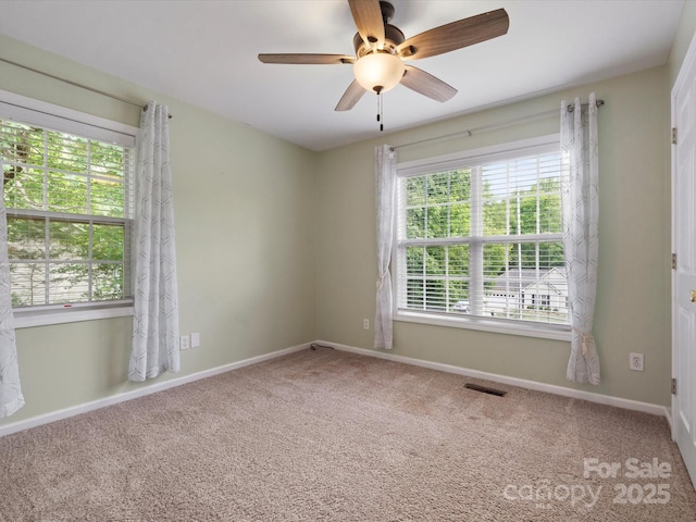 730 Cove Rd, Gastonia, NC 28052 - carpeted empty room with plenty of natural light, ceiling fan, and baseboards